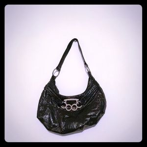 Brass knuckle handbag